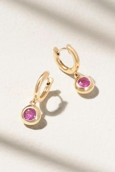 Marlo Laz's 'Gemma Dangle' hoop earrings are a visual spectacle in every way. They're handmade from 14-karat gold and set with pretty pink sapphire charms. Yellow Gold Dangle Huggie Earrings Fine Jewelry, Elegant Pink 14k Gold Hoop Earrings, Fine Jewelry Huggie Earrings With Dangle Design, Elegant 14k Gold Pink Hoop Earrings, Fine Jewelry Tarnish Resistant Dangle Huggie Earrings, Fine Jewelry Tarnish-resistant Dangle Huggie Earrings, Convertible Jewelry, Sapphire Hoop Earrings, Pink Sapphire Earrings