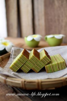 slices of green cake sitting on top of a plate