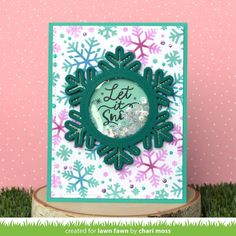 a card with snowflakes on it and the words let it snow written inside