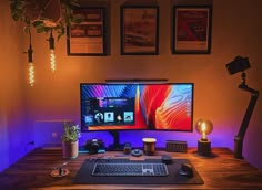 a desktop computer sitting on top of a wooden desk next to a keyboard and mouse