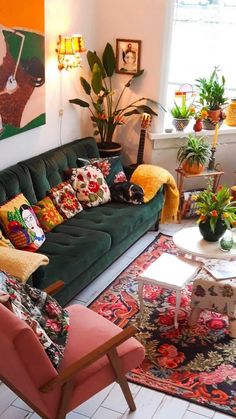 a living room filled with furniture and lots of plants