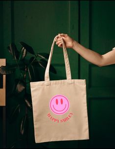 Fabric bag smiley, shoulder bag, smiley jute bag, shopping bag with smiley, shopper, neon pink, farewell gift, birthday gift Our shopper is the perfect shopping bag, it combines style and functionality and is the perfect companion for your everyday life. The smiley jute bag is made of 100% cotton and offers enough space for everything you need - be it for shopping, university or the beach. With our unique design you stand out from the crowd and make a statement. The attractive graphics give your Fun Pink Cotton Bag, Playful Pink Cotton Bag, Pink Eco-friendly Canvas Bag For Shopping, Pink Eco-friendly Canvas Shopping Bag, Eco-friendly Pink Canvas Gift Bag, Eco-friendly Pink Canvas Shopping Bag, Trendy Pink Canvas Bag For Gift, Trendy Pink Canvas Bag As Gift, Jute Bag