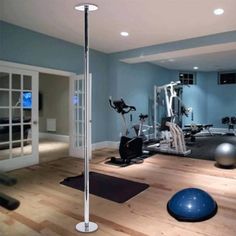 a gym with exercise balls and machines in it