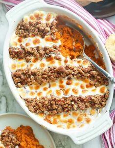 a casserole dish filled with meat and cheese