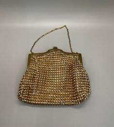 "Vintage Whiting & Davis gold mesh evening bag circa 1940s. There are other Whiting & Davis mesh bags that were made later than 1940s. This bag is the real deal from years ago - please look closely at the pictures. This is a heavy multidimensional mesh bead. Delicate chain has a 5\" hang to this beautiful vintage purse. Bag is 6\" by 5\". 190 grams. Packaged for gifting. Free Shipping." Mesh Bags, Gold Bag, Vintage Purse, Delicate Chain, Mesh Bag, Purse Bag, Clutch Handbag, Evening Bags, Purses And Handbags