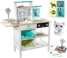 a toy kitchen with various items on the table and in it's display case