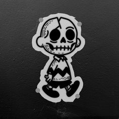 a black and white sticker with a skeleton on it