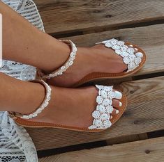 SHIPPING via DHL EXPRESS WORLDWIDE: 1 - 4 business days delivery (Please fill in your phone number if you choose Express Shipping) ★ More wedding sandals and shoes: See my store: https://www.etsy.com/shop/PelinoSandals 💓 Handmade genuine Greek leather wedding sandals decorated with romantic lace or crystals,pearls,rhinestones ( all the embellishments are hand sewn onto the leather straps) for brides dreaming of a beach wedding, a Bachelor party or even a city wedding. I am here to create with y Bridal Beach Sandals, Shoes Beach Wedding, White Sandals Wedding, Flat Sandals Wedding, Beach Wedding Sandals, Sandals Wedding, Leather Wedding, Handmade Sandals, Bridal Sandals