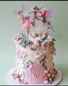 a cake decorated with pink and purple flowers