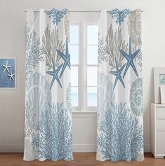 the curtains are decorated with blue and white seaweed, starfish and corals