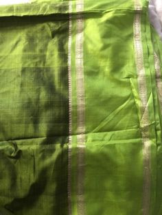 New Pure Silk Saree Material is very lightweight fine soft silk Beautiful Lime green colour with shaded green colour and vibrant green border  Slim zari border Fall is done Any questions please ask No returns Thank you for viewing Green Anarkali Chanderi Blouse Piece, Green Slub Silk Blouse Piece With Zari Work, Green Raw Silk Traditional Drape Wear, Green Raw Silk Traditional Wear, Green Slub Silk Blouse For Festivals, Festival Green Slub Silk Blouse Piece, Green Art Silk Dupatta For Festivals, Green Raw Silk Traditional Wear With Traditional Drape, Green Bollywood Art Silk Dupatta