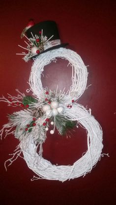 the number eight made out of string and christmas decorations