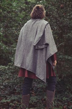 This cloak gives you the feeling of standing on an Irish cliffside at dawn. But the chilly wind of Ireland is best enjoyed in warmth! The Ruana cloaks are made in the traditional style with an amazing selection of beautiful wool fabrics to keep you warm and dry as you listen to crashing waves. *Please note that our wool fabric comes from small dye batches, colors may vary due to screen settings.* Exchange/Return Policy Complete the look with Pose Wigs! She is wearing Bloom True Silver - Lace Fro Medieval Style Fall Cape Outerwear, Bohemian Wool Cape Outerwear, Medieval Style Fall Cape, Medieval Style Winter Cape Outerwear, Medieval Winter Cape Outerwear, Medieval Style Cape For Larp In Fall, Medieval Cape For Larp In Fall, Medieval Cape For Fall Larp Events, Medieval Style Winter Cape