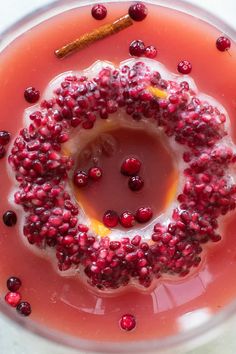 an orange plate with pomegranate and cinnamon on it