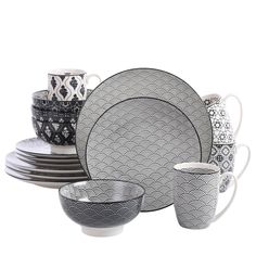 a black and white dinnerware set on a table