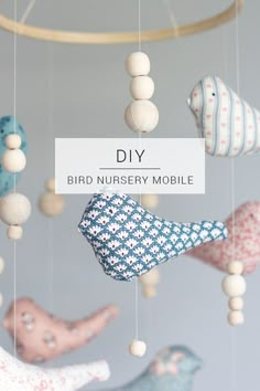 a mobile with birds and balls hanging from it's sides that says diy bird nursery mobile