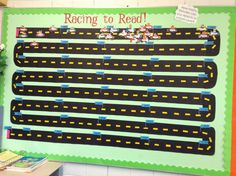 a bulletin board with cars on it in a classroom setting that says racing to read