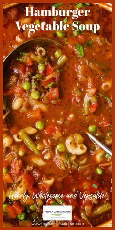 a bowl of vegetable soup with a spoon in it