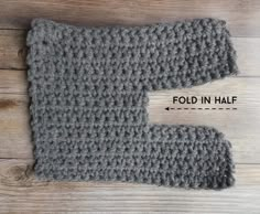 a crocheted mitt with the text fold in half on top of it