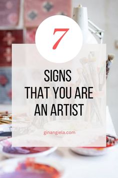 the words 7 signs that you are an artist on top of a table with art supplies