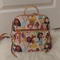 Nwt Price Is Firm Not Accepting Offers Any Offers Will Be Kindly Ignored Or Declined Disney Parks Collection X Dooney And Bourke Disney Princess Bookbag Brand New With Tags Selling As Is New With Tags Please See All Pictures This Is The Exact Placement You Will Receive 100% Authentic As Always Disney Parks Exclusive Approx Size 9 1/4'' H X 10'' W X 4'' D Handle Drop: 2'' Strap Length 14'' No Price Police/No Rude Comments No Trades/No Holds All Items Are Always Triple Protected Before Mailing Out Dooney And Bourke Disney, Disney Dooney, Grey Backpacks, Chestnut Leather, Drama Free, Vintage Backpacks, Patterned Backpack, Black Leather Backpack, Dooney And Bourke