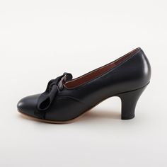 Glamour and practicality pair perfectly with the beautiful Hazel slip-on pumps. Glossy leather, an almond-shaped toe, 2.5 in / 6.35 cm repro heel, and the cutest little ribbon bow tie make these beautiful shoes perfect for the 1920s all the way through to 1950. [custom tab] Sizing Size Trends Runs true to size for most customers. Width Regular (B) width Size Chart Materials Color Black Upper 100% Calf Leather Lining Pigskin leather Sole Leather Heel Leather Covered Heel Height 2.5 inch / 6.35 cm 1950s Shoes, Ribbon Bow Tie, American Duchess, Vintage Pumps, Slip On Pumps, Black Pumps Heels, Rich Man, The 1920s, Pig Skin