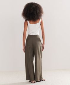 Relaxed Trouser Dark Moss Made from 100% textural raw silk for an effortless look that's equally polished and comfortable. With tailored pleats that seamlessly transition into a wide-leg silhouette, the Relaxed Trouser is the definition of California cool. Pair it with a classic cami or tee or embrace an oversized aesthetic from head-to-toe with your favorite lightweight knit. Viscose Wide Leg Pants For Daywear, Casual Silk Wide Leg Pants, Elegant Wide Leg Rayon Pants With Relaxed Fit, Elegant Wide Leg Pants In Rayon With Relaxed Fit, Medium Wash Relaxed Fit Trousers, Relaxed Fit Khaki Wide-leg Pants, Relaxed Fit High-waisted Linen Wide Leg Pants, Relaxed Fit Khaki Wide-leg Bottoms, Dark Wash Relaxed Fit Trousers