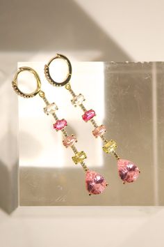 Expertly crafted, these earrings are made with 14K gold vermeil and adorned with a mix of pink multi-cz droplets, measuring at 3 inches. Embrace the vibrant yet elegant design of these huggie earrings that will make a statement for any occasion. Huggie Earrings, Huggies Earrings, Gold Vermeil, Elegant Design, Gems, Gold, Pink, Design