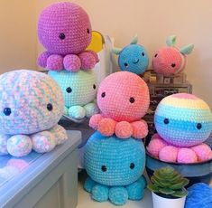 crocheted stuffed animals sitting on top of a table