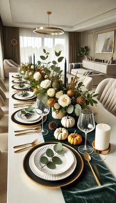 a dining room table set with white and green plates, gold rimmed place settings and greenery