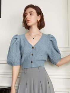 Editor's Notesyyiam curates feminine and classic daily outfits that suit well to modern women. - Voluminous puff sleeves- Elaborately knitted fabric- Deep v-neckline- Button-down style- Feminine and sophisticated mood Measurements(in.)[ S / M ]- Length: 17.32 in. / 17.72 in. - Shoulder Length: 12.20 in. / 12.60 in.- Bust: 36.22 in. / 37.80 in.- Hem Circumference: 28.35 in. / 29.92 in. - Sleeve Length: 14.96 in. / 15.35 in.* Model info: Size S / Height 5' 7 Composition & Care- Material: 50% Wool, 50% Polyester- Lightly hand wash or dry clean Designer- by yyiam Fitted Puff Sleeve Textured Knit Sweater, Chic Puff Sleeve Top For Winter, Fitted Puff Sleeve Cardigan For Winter, Spring Knit Cardigan With Puff Sleeves, Fitted Puff Sleeve Winter Cardigan, Chic Fitted Cardigan With Puff Sleeves, Elegant Fitted Cardigan With Puff Sleeves, Knit Puff Sleeve Cardigan For Winter, Elegant Puff Sleeve Cardigan For Spring