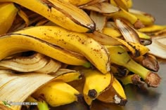 bunches of bananas are piled on top of each other in a pile and ready to be eaten