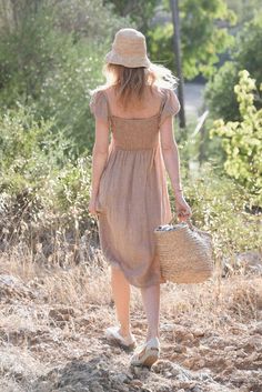 Style // Our Rye color is dreamy in every sense of the word, the perfect faded brown linen dress Effortlessly romantic and oh so pretty, our Menorca Dress is a mid length linen dress designed to transition throughout the year. Pair with sandals for summer or boots for fall and winter. Made from super-soft linen, with puffed sleeves that can be worn the way you love best! Over the shoulder for an elegant square neck line or off-the-shoulder for a feminine touch Fabric Note // Made in Italy from 1 Boho Womens Clothing, Natural Linen Dress, Boots For Fall, Boho Chic Outfits, Summer To Fall, Menorca, Puffed Sleeves, Boho Women, Linen Dresses