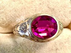 14k ring-hand engraved beautifully, antique, unusual deep pink Sapphire that has a smooth bent top with three facets and is fully faceted on bottom.  Condition is very good, pictures show the details.  Size 5 1/2, width 8mm or 5.5/16", wt.- 3 grams.  A lovely and rare design circa 1920s, with amazing hand engraving, the combination of setting and unusual faceting on stone make this a treasure to behold and wear.  Artistry in jewelry! Antique Engraved Ruby Ring For Wedding, Antique Pink Rose Cut Diamond Jewelry, Vintage Engraved Ruby Ring For Wedding, Antique Pink Jewelry With Rose Cut Diamonds, Victorian Pink Ruby Ring For Anniversary, Pink Victorian Ruby Ring For Anniversary, Pink Ruby Wedding Ring Stamped 14k, Pink Ruby Ring Stamped 14k For Wedding, Antique Pink Ruby Ring