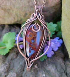 This pendant is made by hand with woven, antiqued and polished solid copper wire. It will arrive gift boxed and ready for giving.  Choose your chain length at checkout.  Moss agate is said to encourage tranquility and emotional balance. Agate is also a powerful tool for cleansing the aura.  This pendant measures 6.6x3.3cm Handmade Copper Wire Teardrop Pendant Jewelry, Unique Copper Wire Teardrop Pendant Jewelry, Copper Wire Teardrop Pendant Jewelry Gift, Copper Wire Teardrop Pendant Jewelry For Gift, Earthy Teardrop Jewelry Gift, Earthy Teardrop Jewelry For Gift, Teardrop Copper Wire Jewelry For Gifts, Wire Wrapped Copper Amulet Jewelry, Earthy Hand Forged Pendant Jewelry