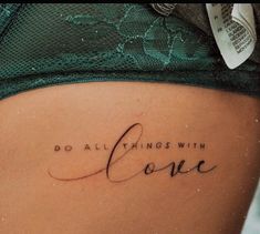 a woman's stomach with the words do all things with love written on it