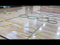 an image of a bowling court with rings on the floor and pins in the middle