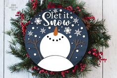 a christmas wreath with a snowman on it