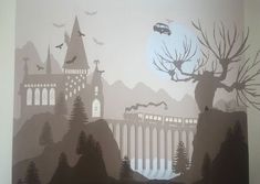 a wall with a castle and trees painted on it