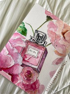 a watercolor painting of pink flowers and a perfume bottle on a white sheet with the words love is in the air