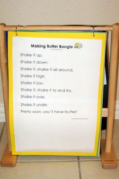 a wooden frame holding a sign that says making butter boggie shake it up, shake it down and shake it high