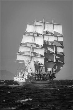 a large sail boat sailing across the ocean