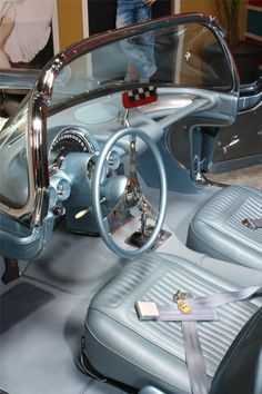 the interior of an old car with chrome trim