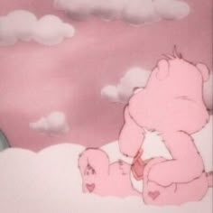 a pink teddy bear sitting on top of a cloud filled sky