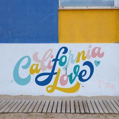 a wall with the words california love painted on it