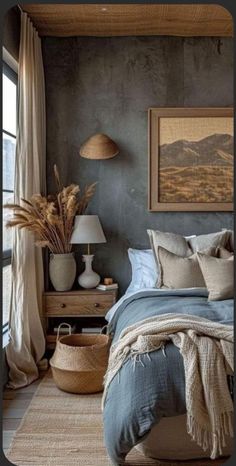 a bedroom with a bed, two lamps and pictures on the wall