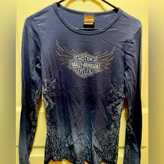 Harley-Davidson Of Youngstown, Oh Blue Crew Neck Long Sleeve T-Shirt. Rhinestones On Front. Graphics On Sleeves, Front And Back. Size S. Nwot Casual Rhinestone Crew Neck Top, Casual Crew Neck Top With Rhinestones, Fitted Blue Tops With Rhinestones, Blue Embellished Long Sleeve Top, Blue Crew, Blue Rhinestones, Long Sleeve T Shirt, Harley Davidson, Long Sleeve Tshirt