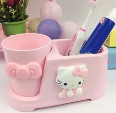 🦷 Sanrio Hello Kitty Toothbrush Holder - Cute Dental Care 🦷 🌟 Cute Dental Companion: The Sanrio Hello Kitty Toothbrush Holder is more than just a holder; it's a cute companion for your dental care routine. Featuring Hello Kitty's charming design, it adds a delightful touch to your daily hygiene. 💖 Charming Features: Hello Kitty's sweet face and iconic bow make this toothbrush holder a delightful way to keep your toothbrushes organized. It's not just a holder; it's a symbol of your affection Hello Kitty Toothbrush, Toiletries Storage, Bathroom Storage Boxes, Daily Hygiene, Toothbrush Organization, Toothbrush Storage, Hello Kitty Art, Cup Set, Toiletry Storage