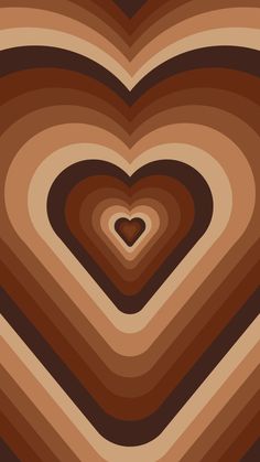 a heart shaped object is shown in the middle of an abstract image with brown and tan colors