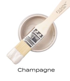 a paint can with a brush in it and the words champagne written across the top